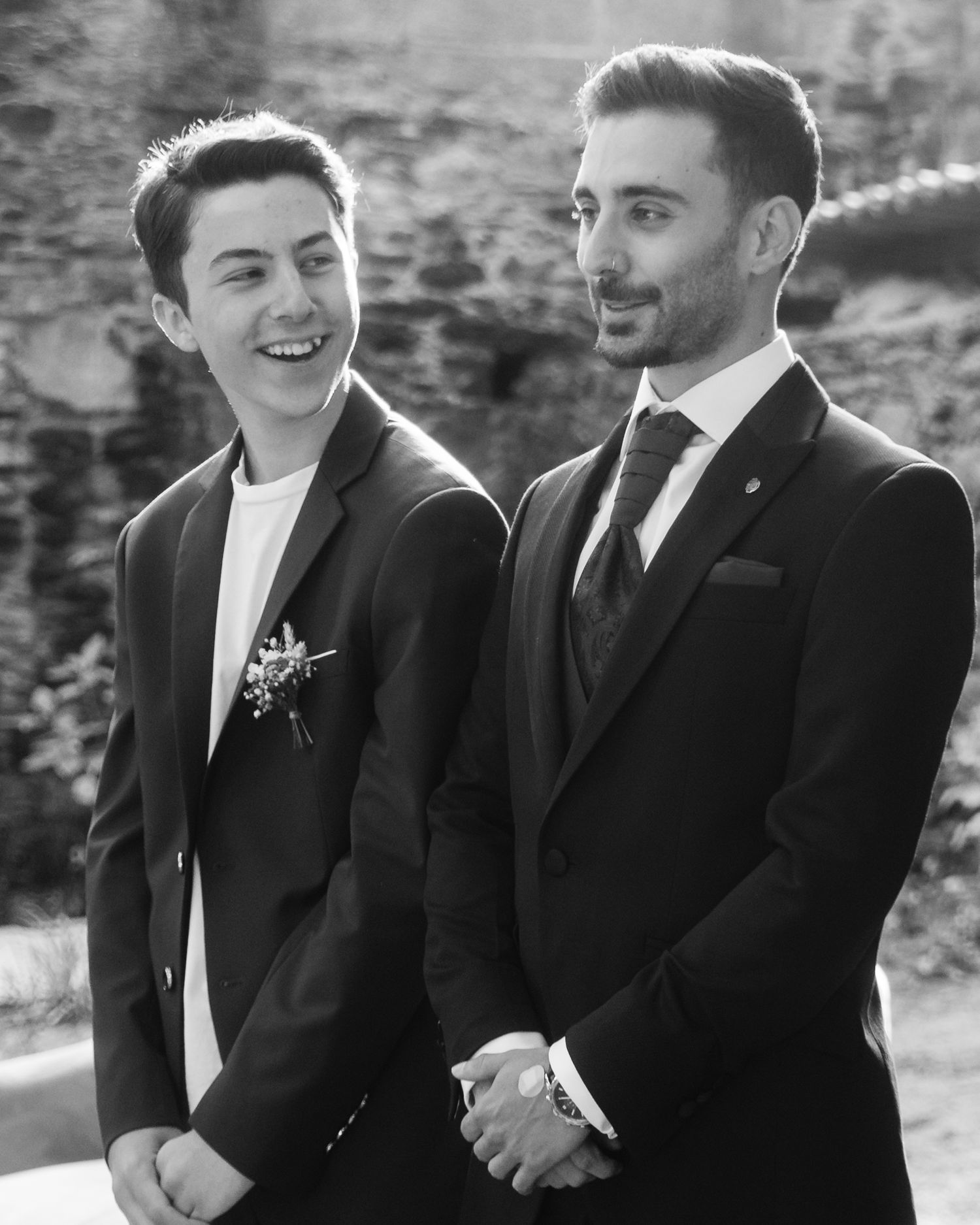 Black and white candid shots showing joyful moments at a formal event.