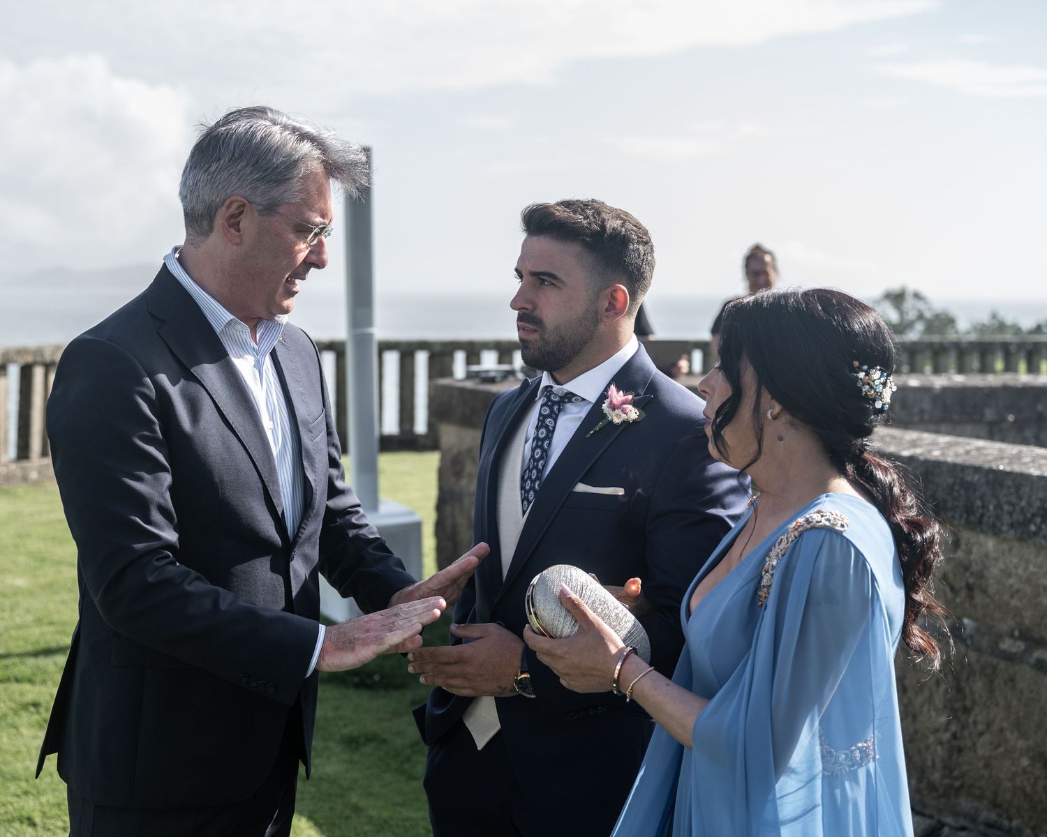 A series of candid moments between a couple sharing drinks and laughter at an outdoor wedding celebration.
