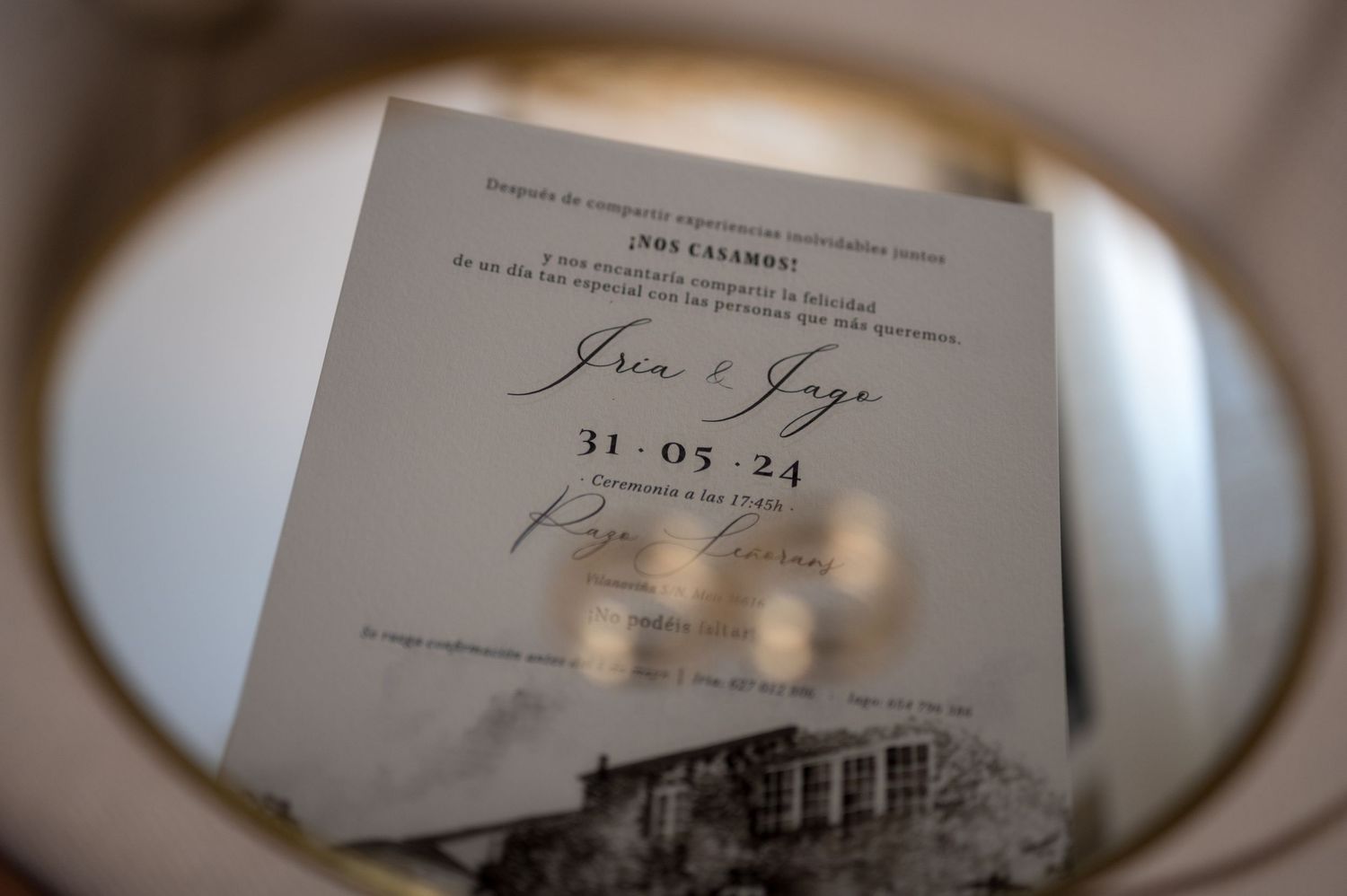 Wedding invitation suite with elegant calligraphy and vintage-inspired design elements laid out on a white surface.