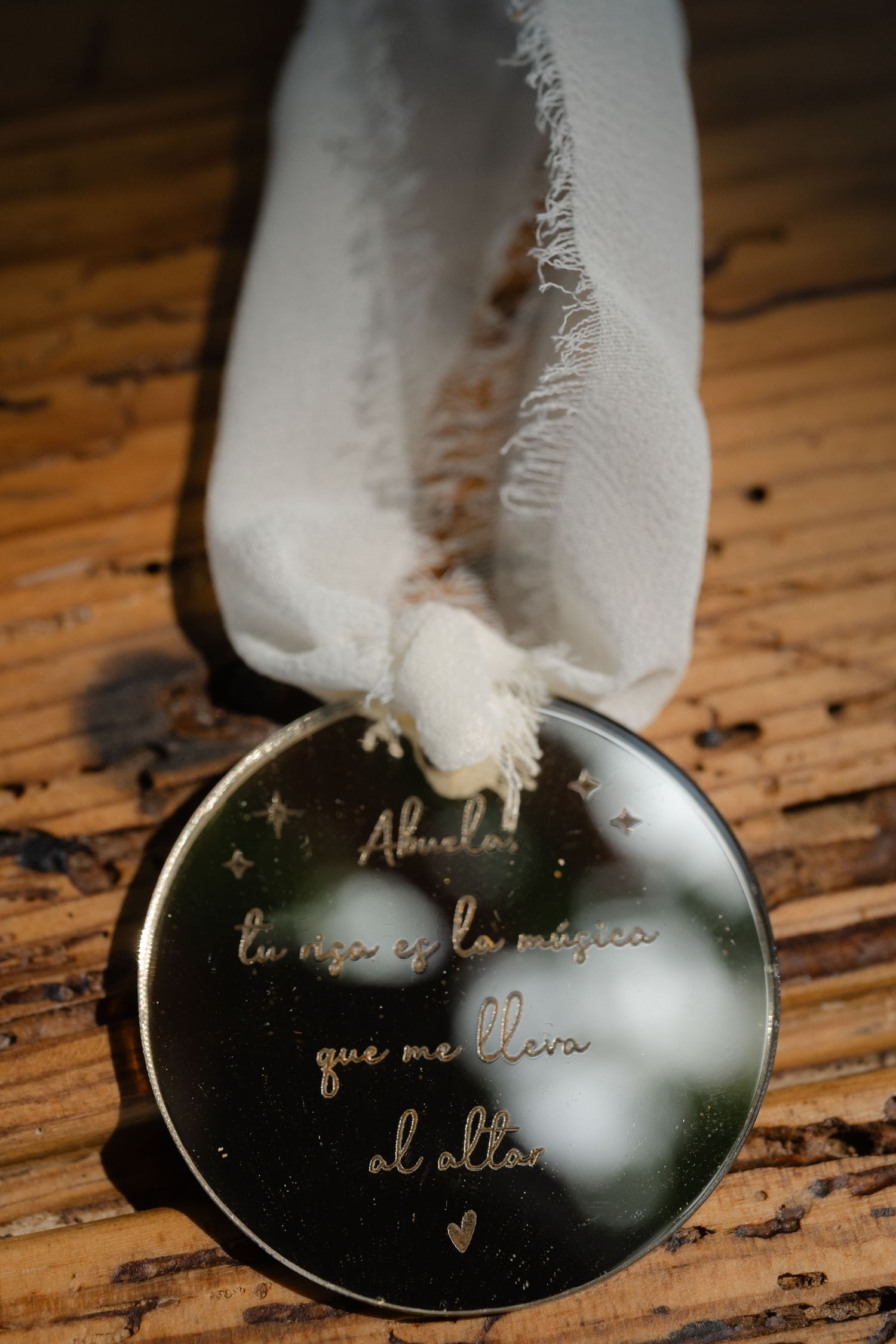 Close-up sequence showing a spoon with engraved text being revealed through wiping away frost or condensation.