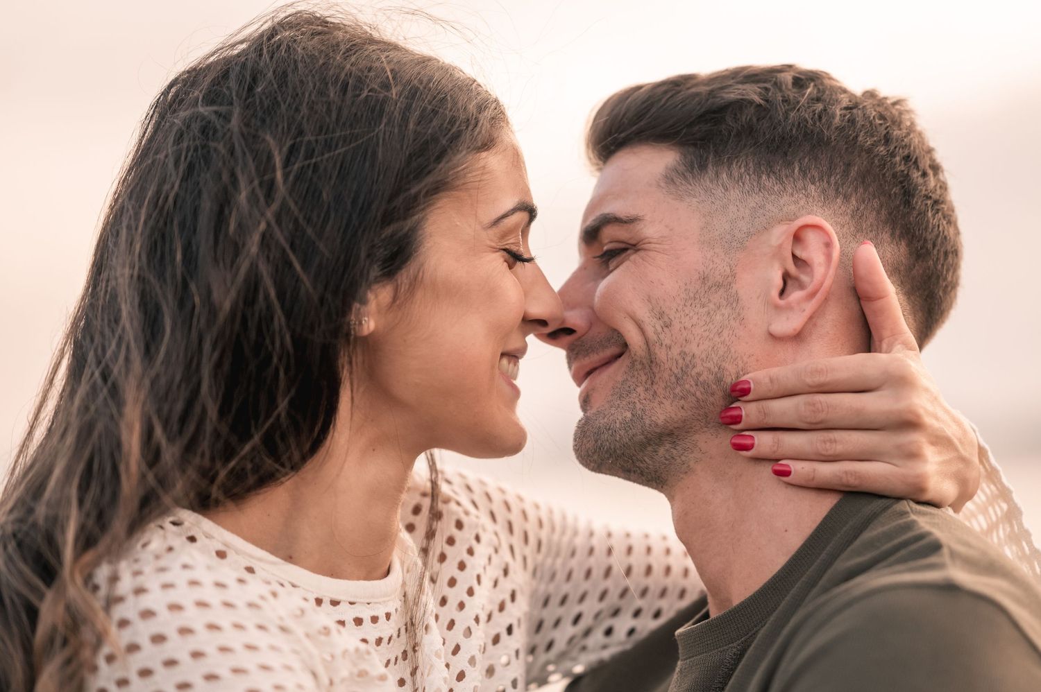 Romantic couple sharing tender intimate moments in a series of close-up photos showing affection and connection.