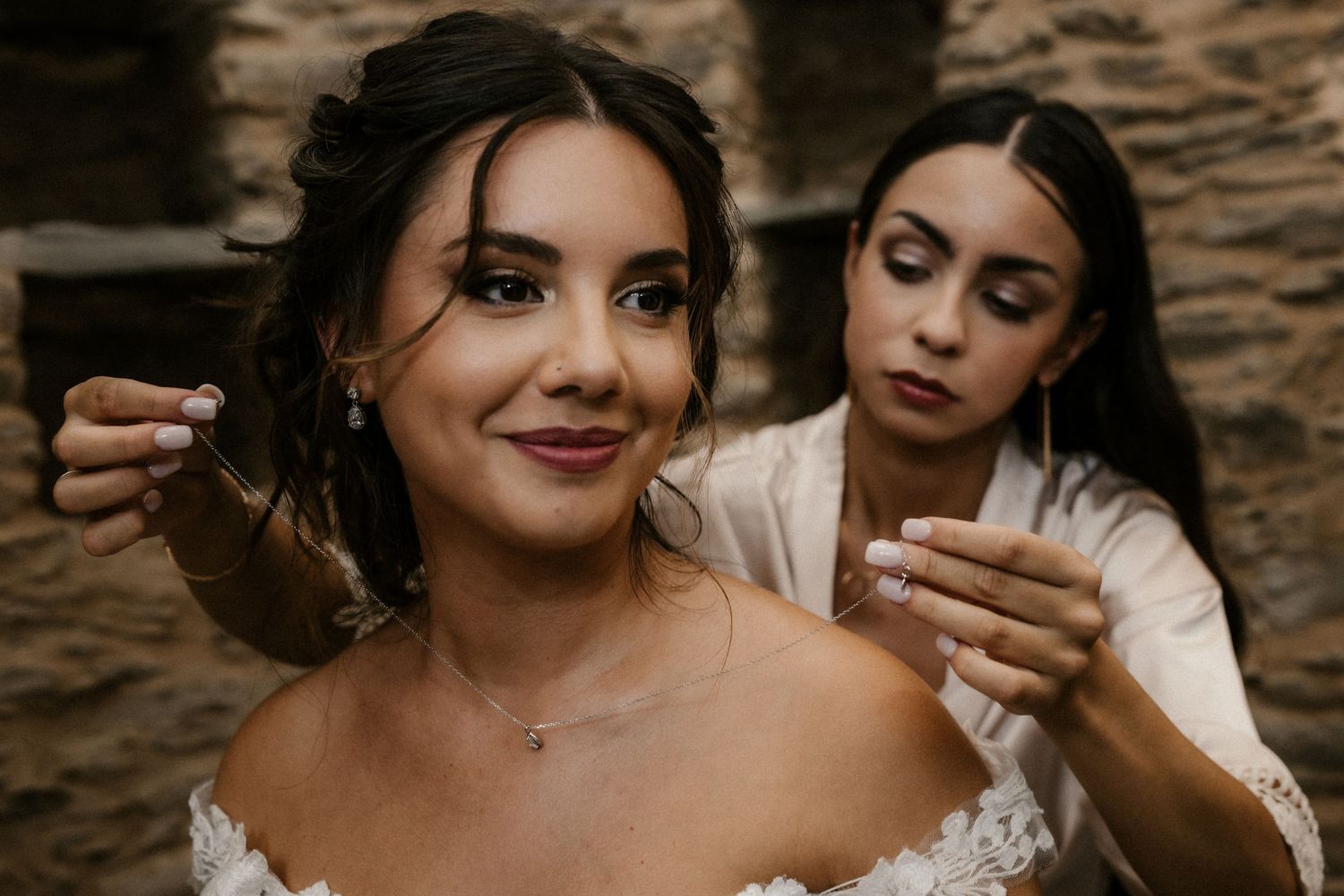 Getting ready scene with elegant wedding styling and preparations in warm moody lighting.