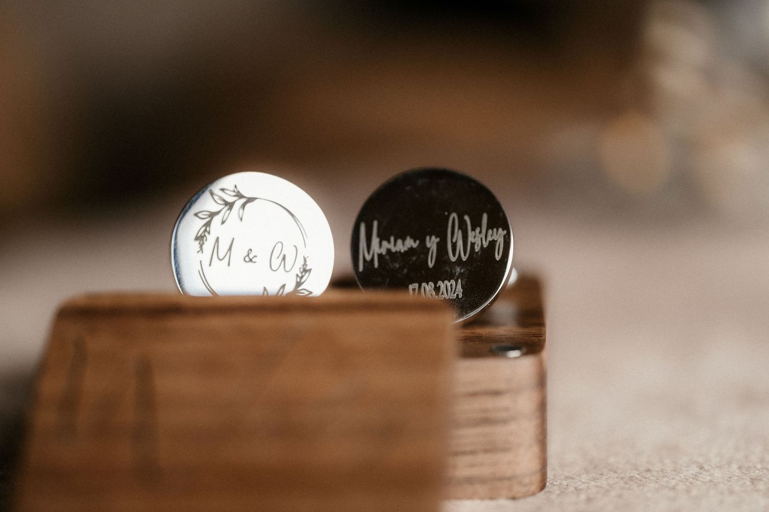 Close-up shot of a wooden wedding ring box with soft focus and warm lighting.