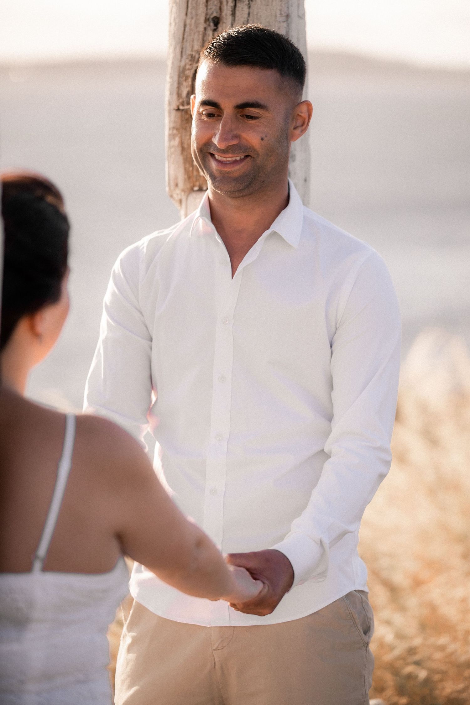 Series of intimate moments captured in soft lighting showing a couple in light colored attire.