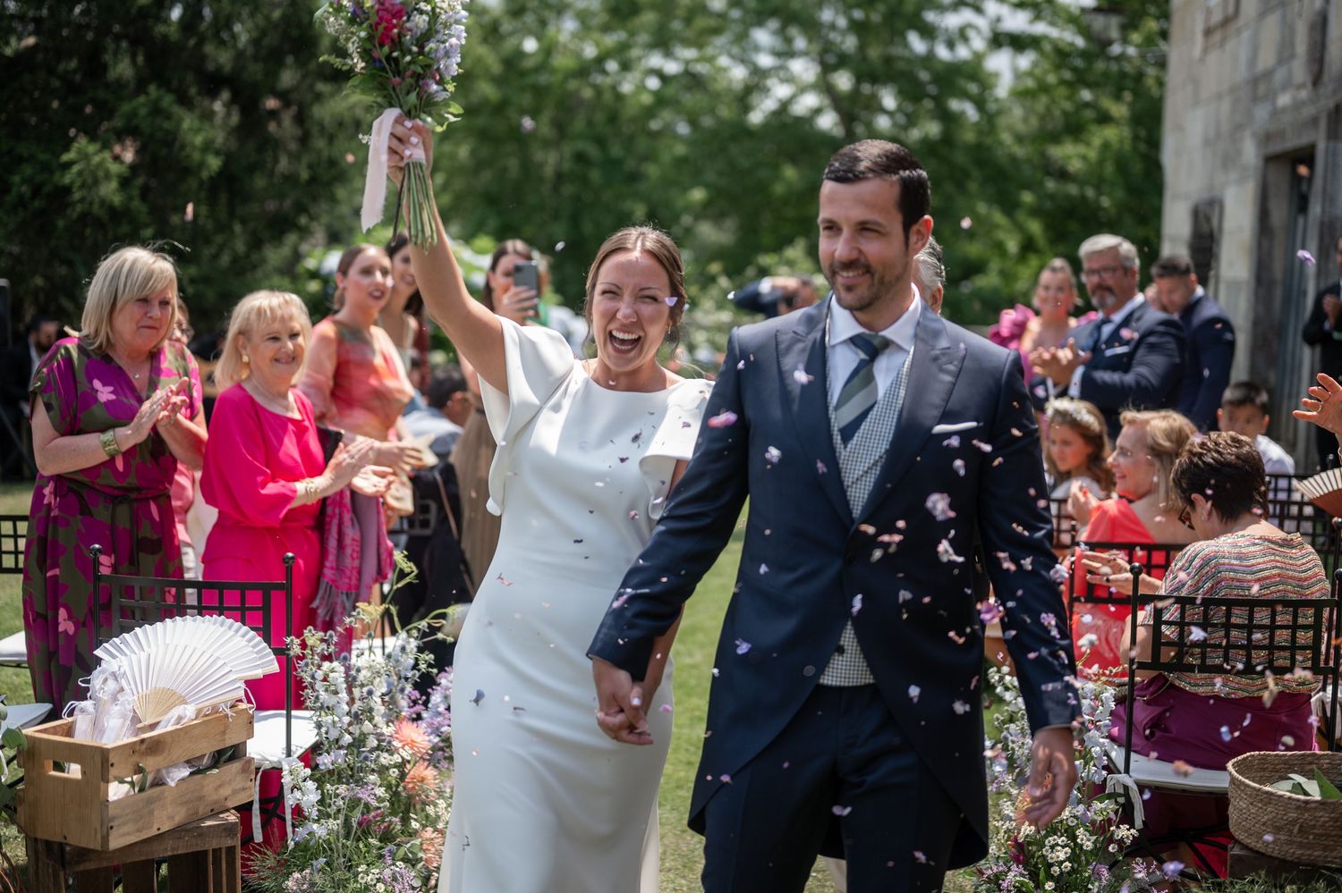 Wedding celebration sequence showing joyful moments with guests throwing confetti outdoors.