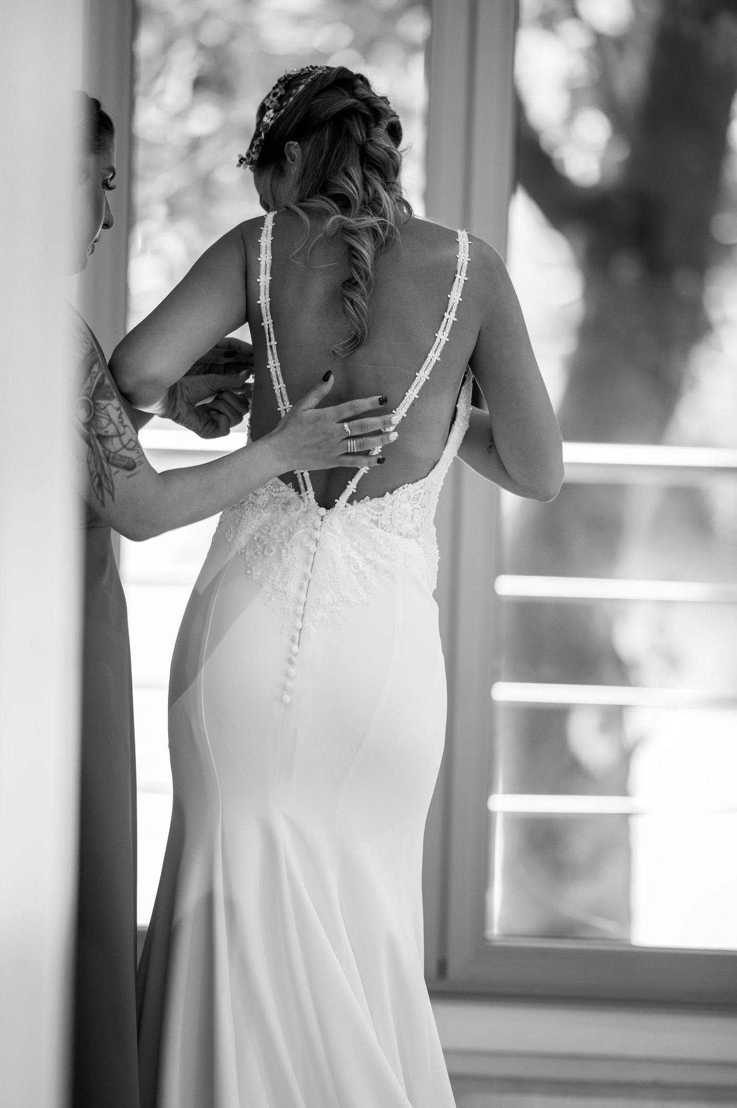A series of four connected photos showing someone in a white wedding dress getting ready for their special day.