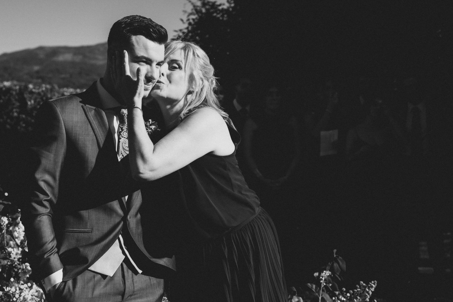 A collection of black and white wedding photographs showing romantic moments between couples dancing and embracing.