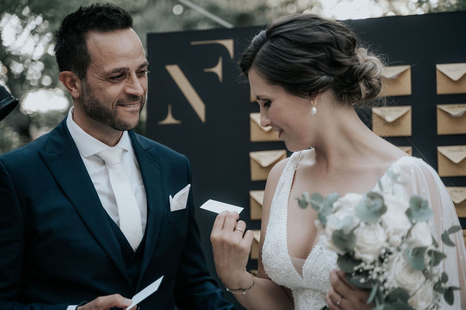 A romantic wedding moment captured in a series of candid black and white photographs showing tender interactions between newlyweds.