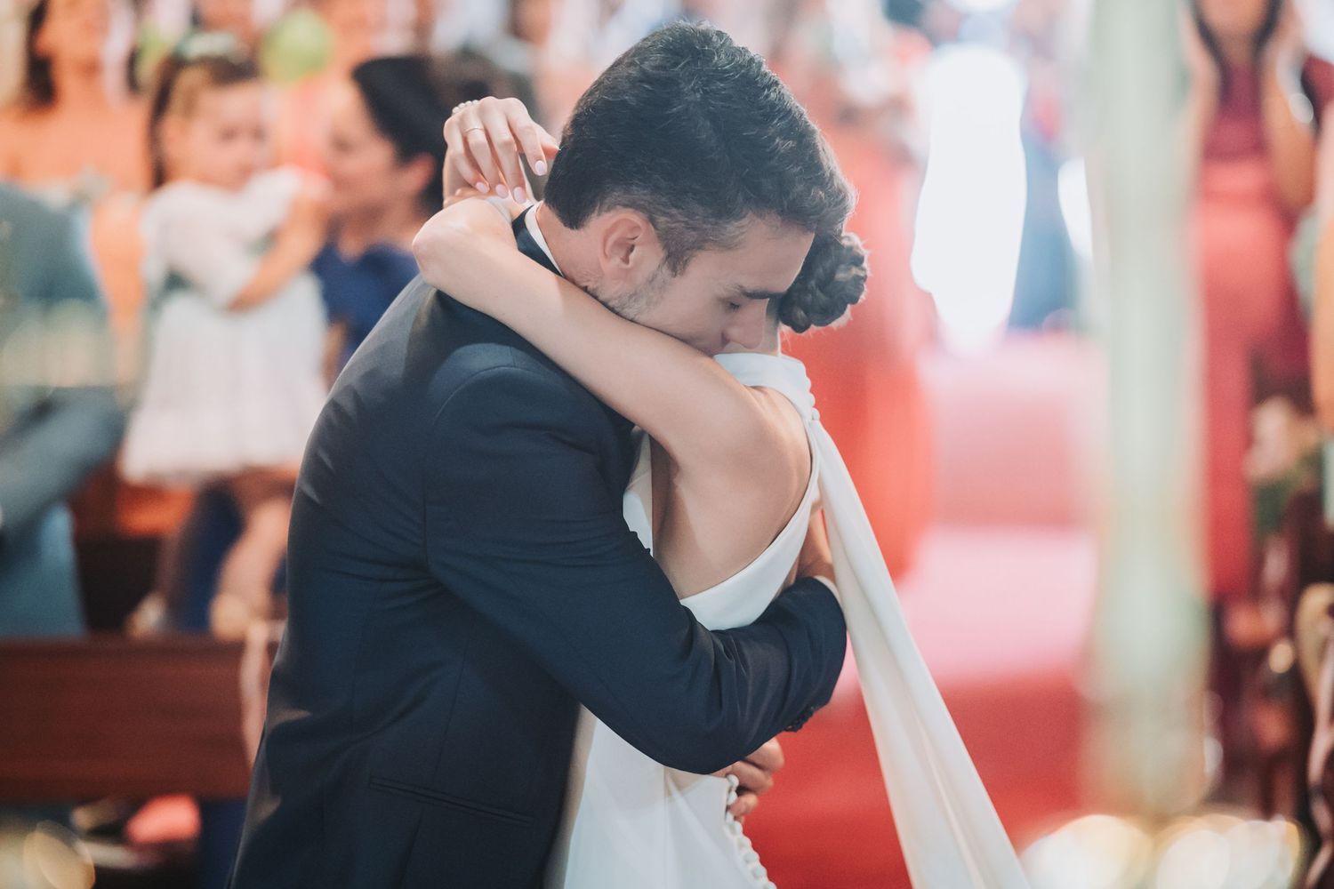 Couple shares a romantic dance embrace during their wedding reception.