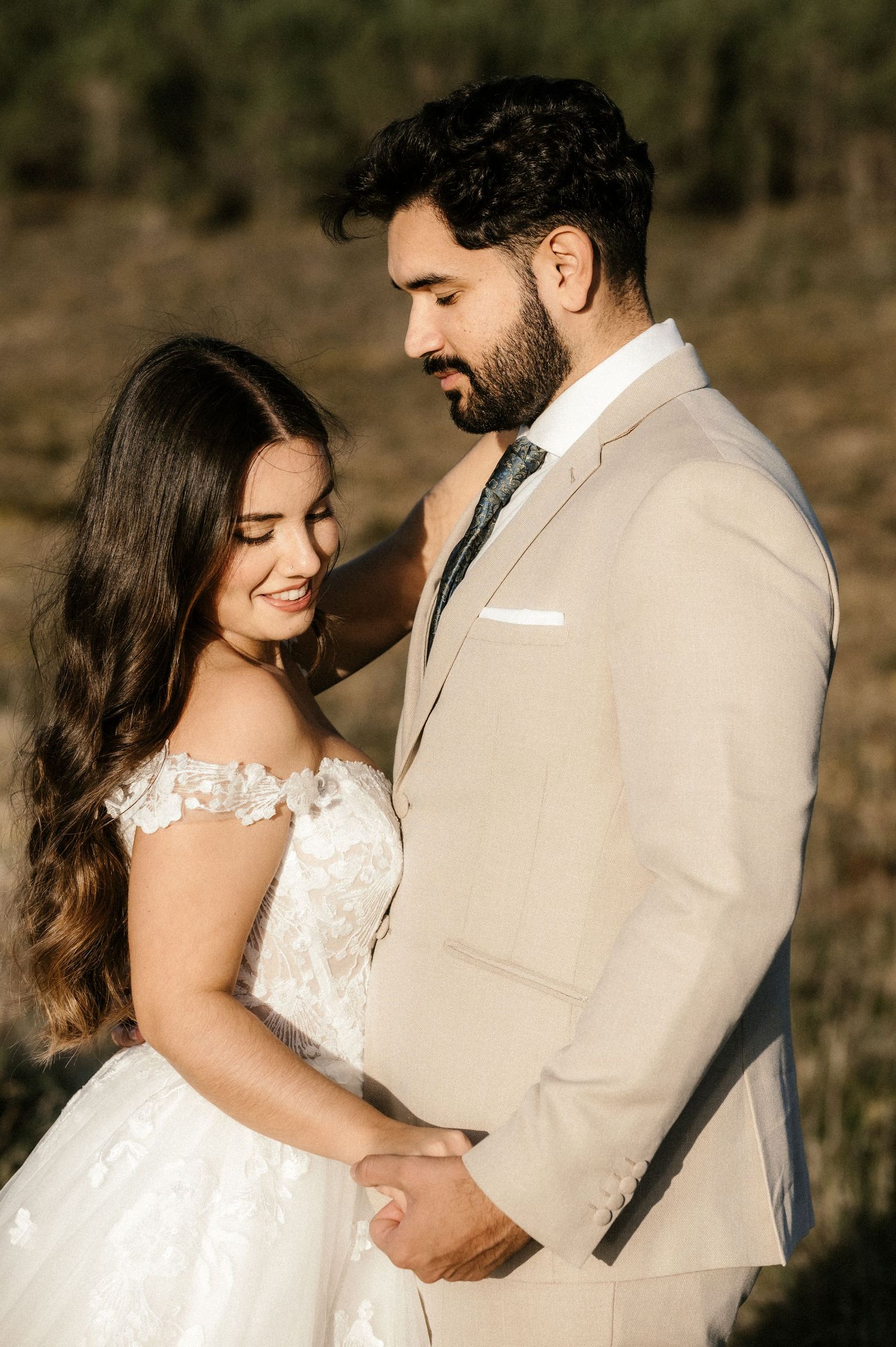 A series of intimate wedding portraits showing a couple in beige and white attire against a natural backdrop.