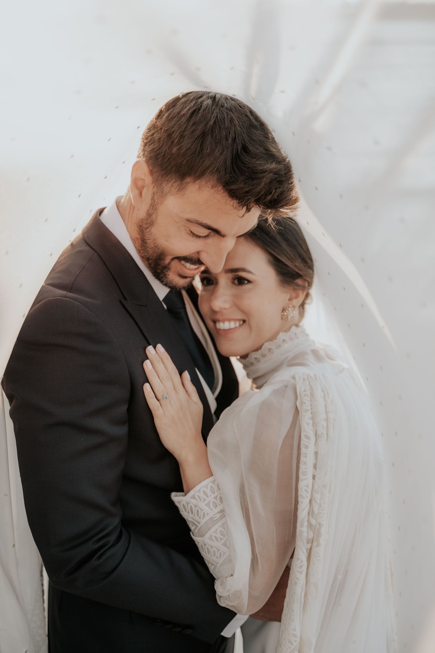 Romantic close-up of couple sharing emotional moment during wedding ceremony.