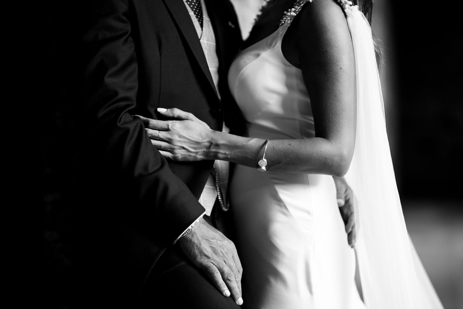 A black and white photo sequence showing a romantic dance between a couple at a wedding reception.