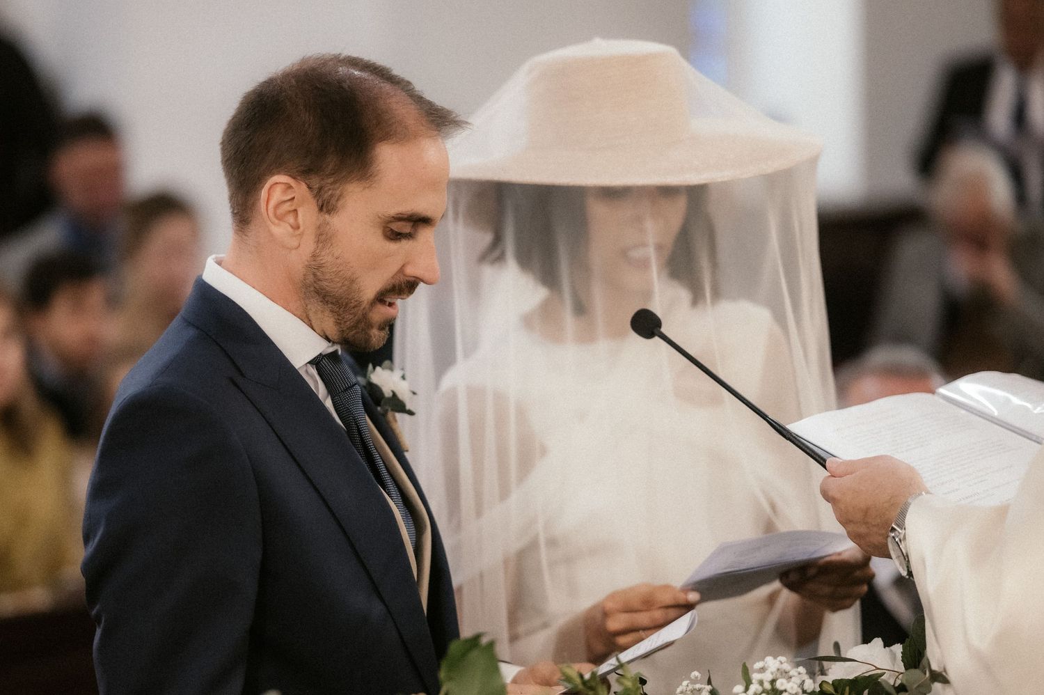 A series of wedding ceremony photos showing a couple exchanging vows and rings at an indoor venue.
