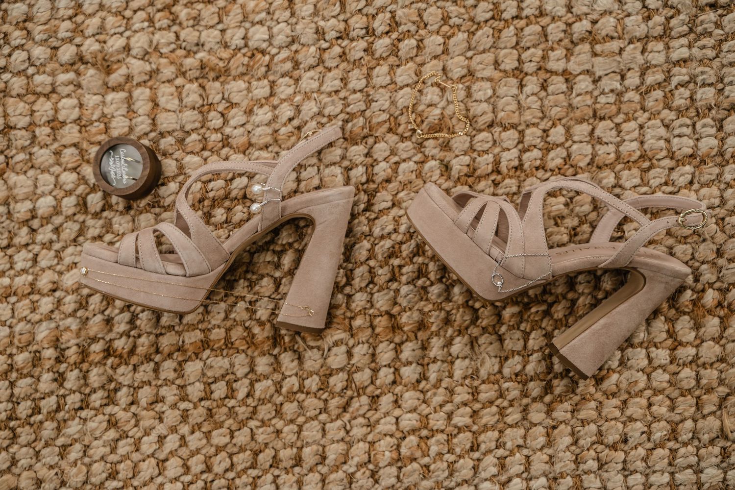 Textured beige woven jute or sisal carpet with natural fiber pattern creates a rustic background texture.