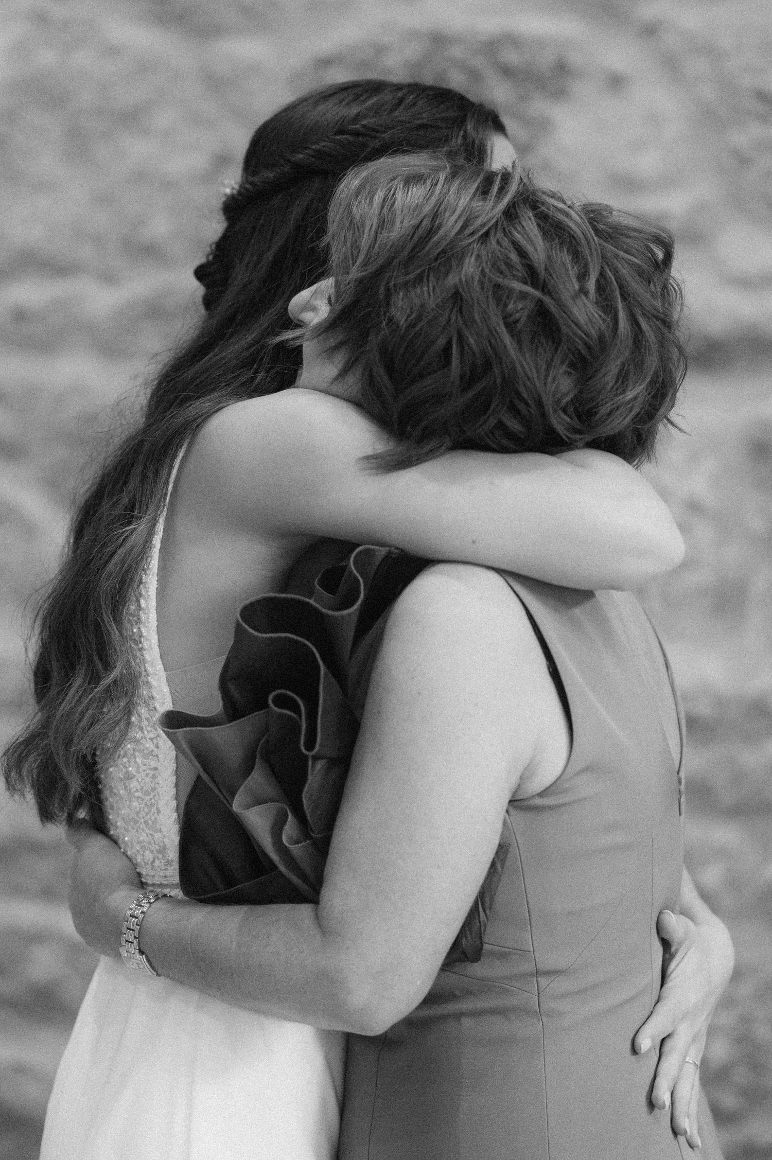 A series of black and white photos showing an emotional embrace between two people.