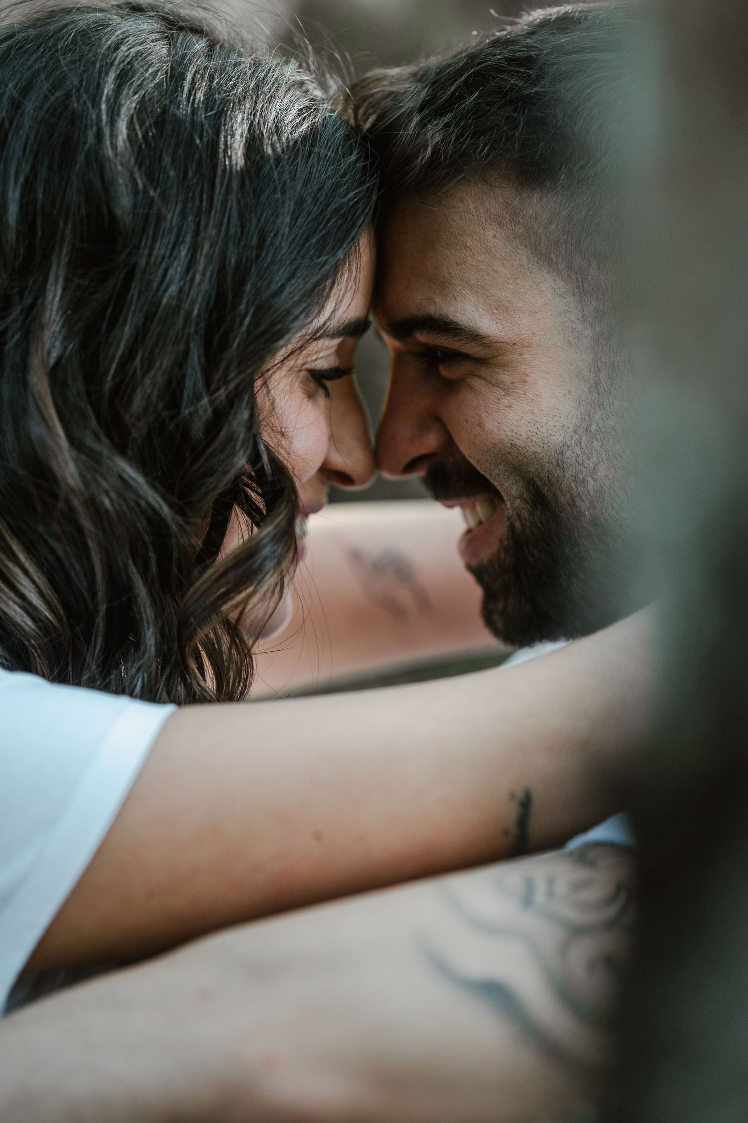Intimate close-up shot of a couple sharing a tender romantic moment together.