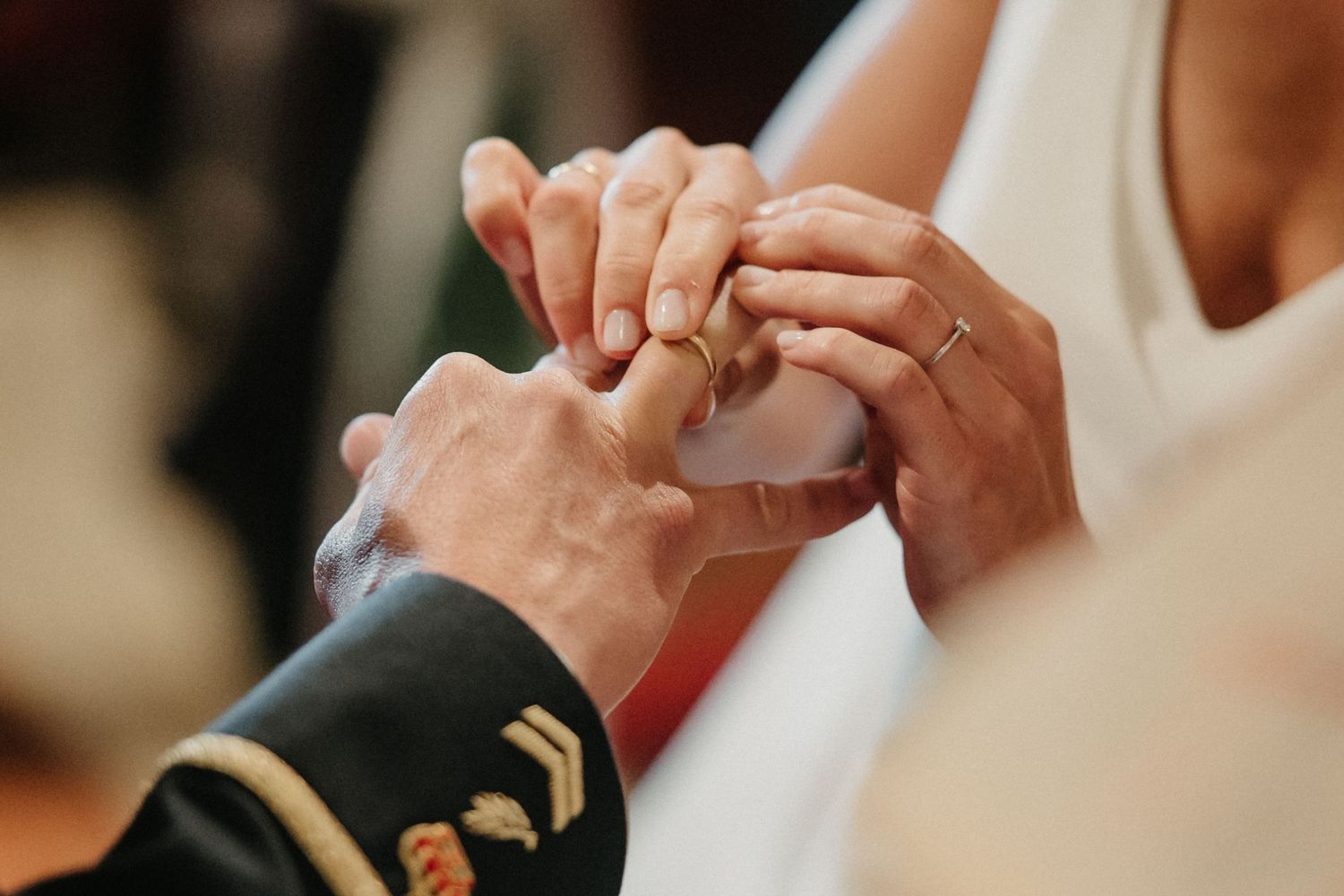 Wedding couple's hands touching tenderly during their ceremony.