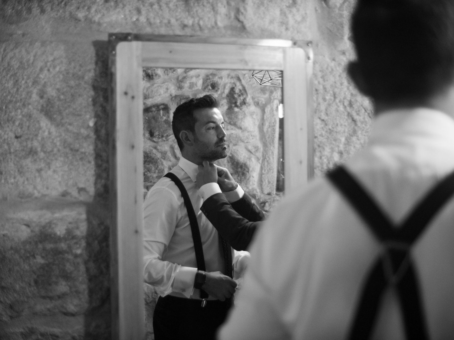 Series of monochrome candid moments captured during what appears to be a wedding celebration.