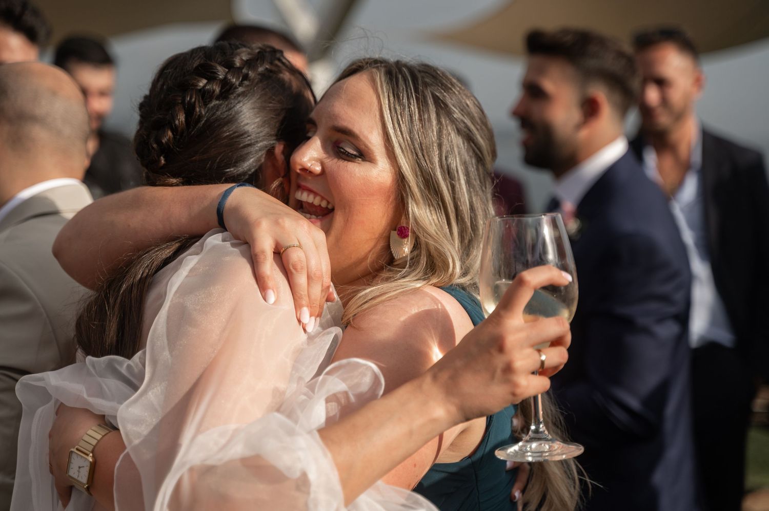 Newlywed couple sharing intimate kisses and embraces during their wedding celebration.