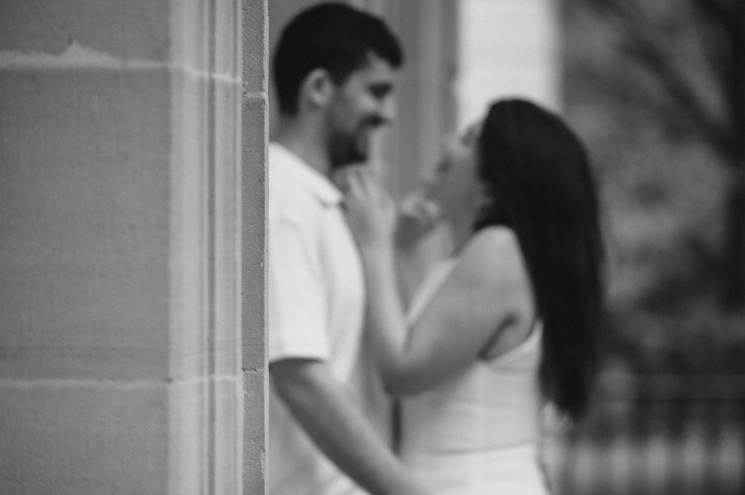 A black and white collage strip showing intimate moments between two people in different poses and settings.