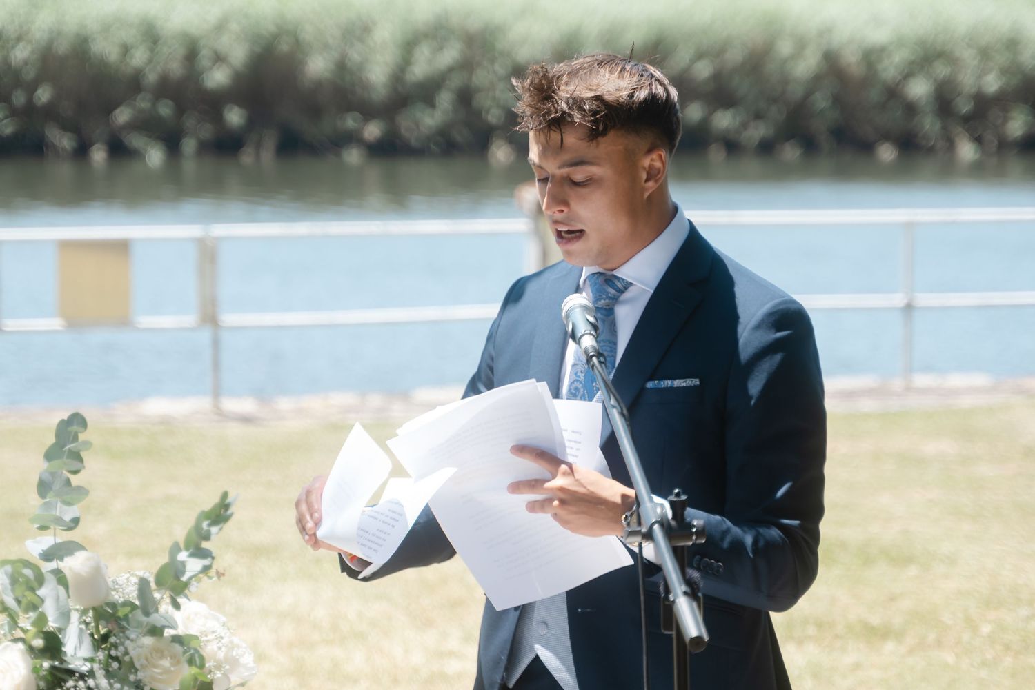 A couple shares an intimate moment during their outdoor wedding ceremony.