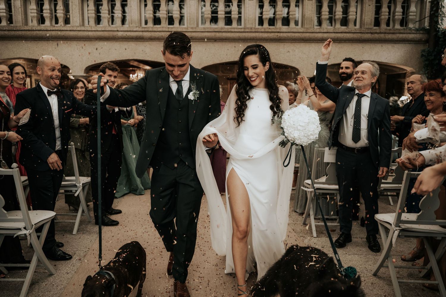A series of candid wedding moments showing dancing and celebration in black and white photography.