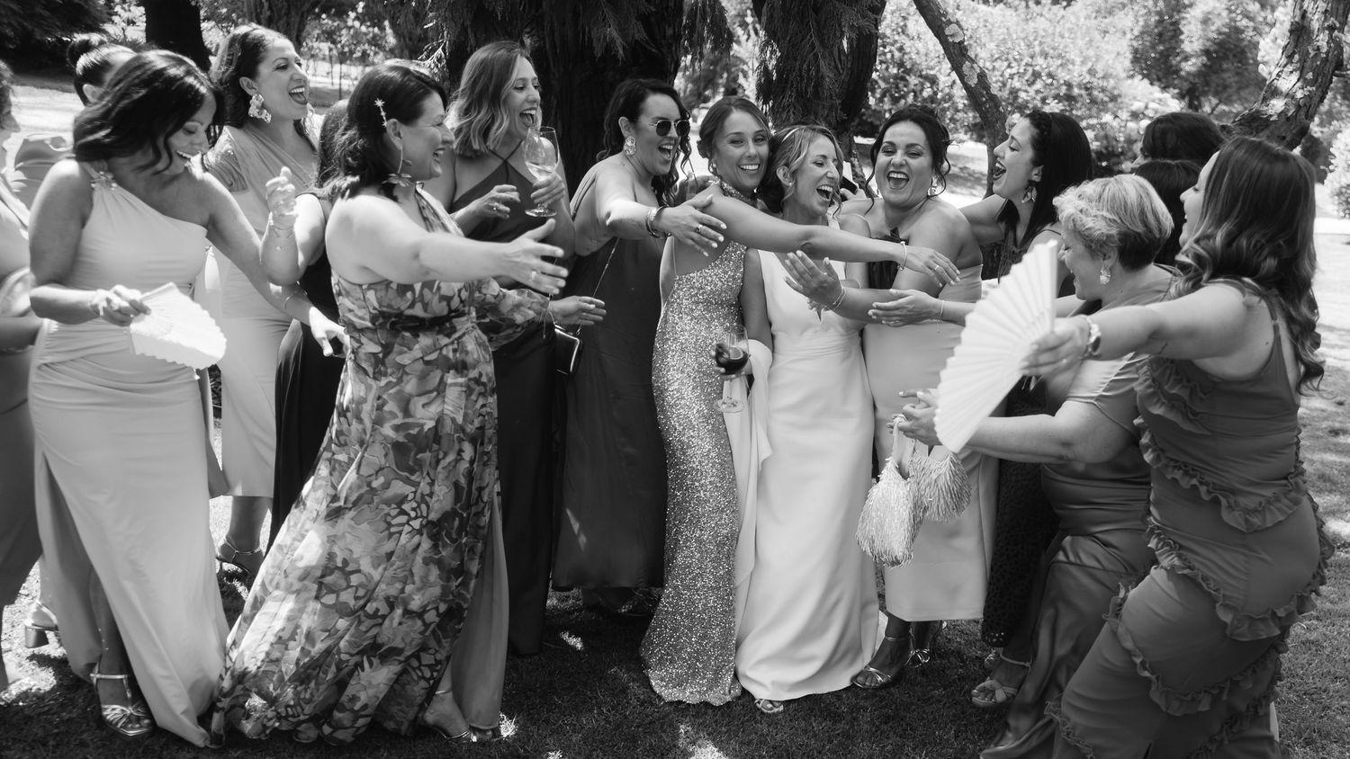 A series of black and white wedding reception photos showing dancing and celebration moments at a festive gathering.
