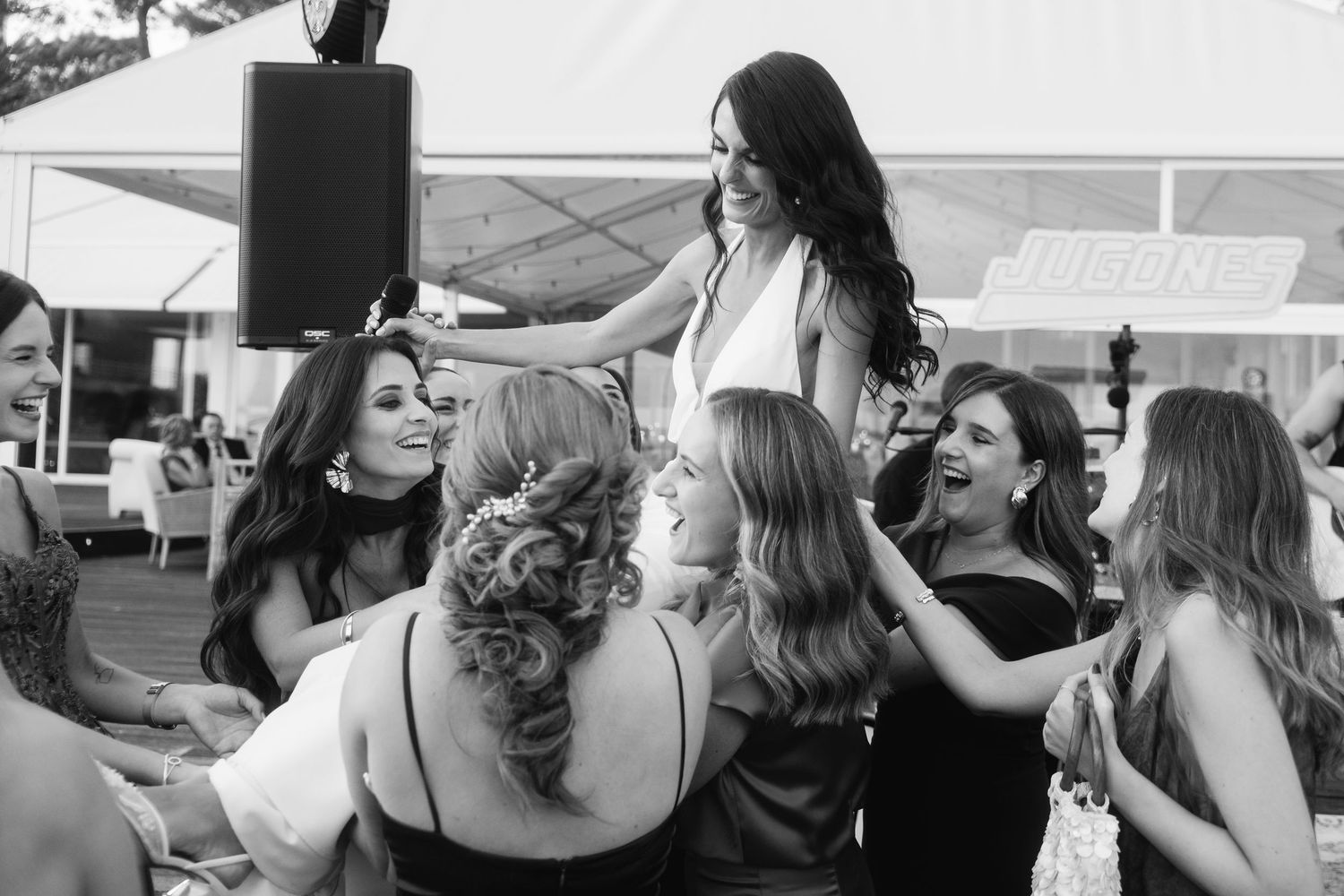 Wedding guests dancing and celebrating together at a reception party.
