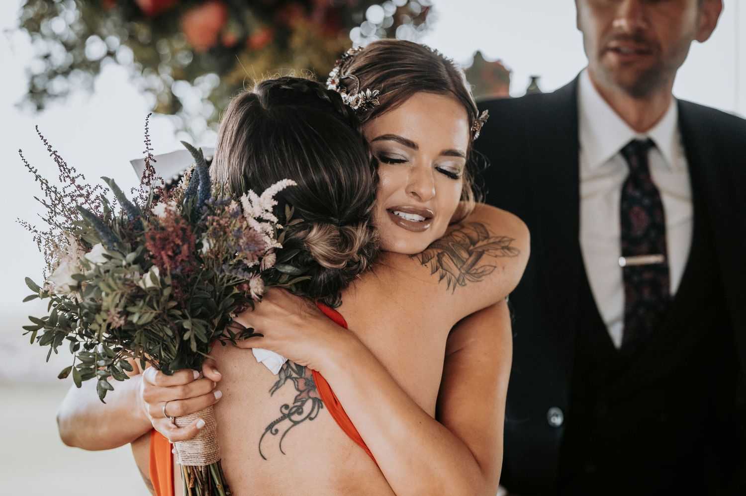 A collection of candid wedding moments featuring romantic poses and floral bouquets in dark moody settings.