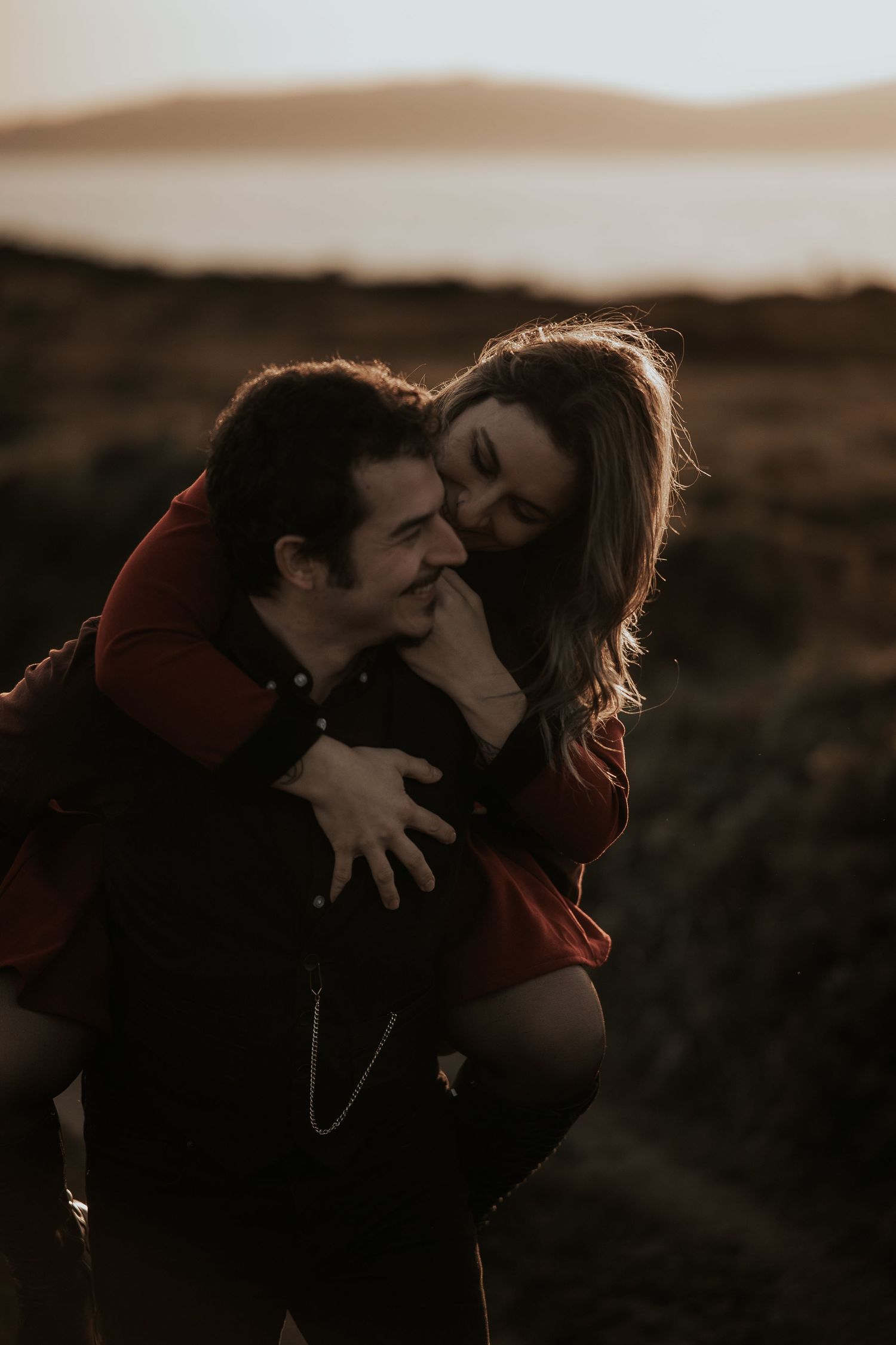 Intimate couple photography sequence showing romantic embraces at sunset in a desert landscape.