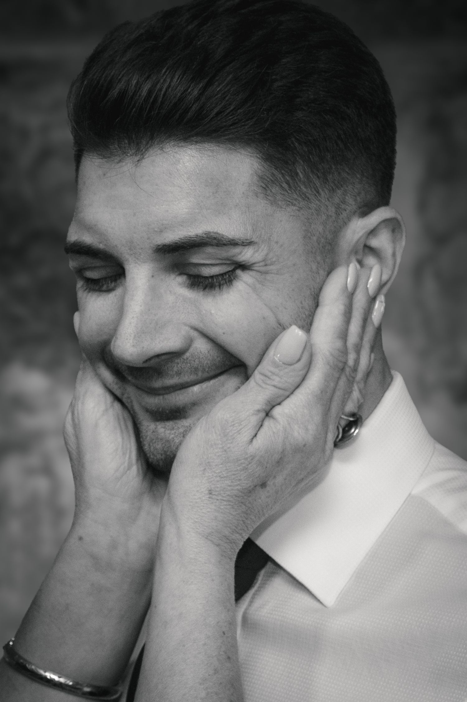 Series of black and white photos showing emotional reactions with hands covering faces.