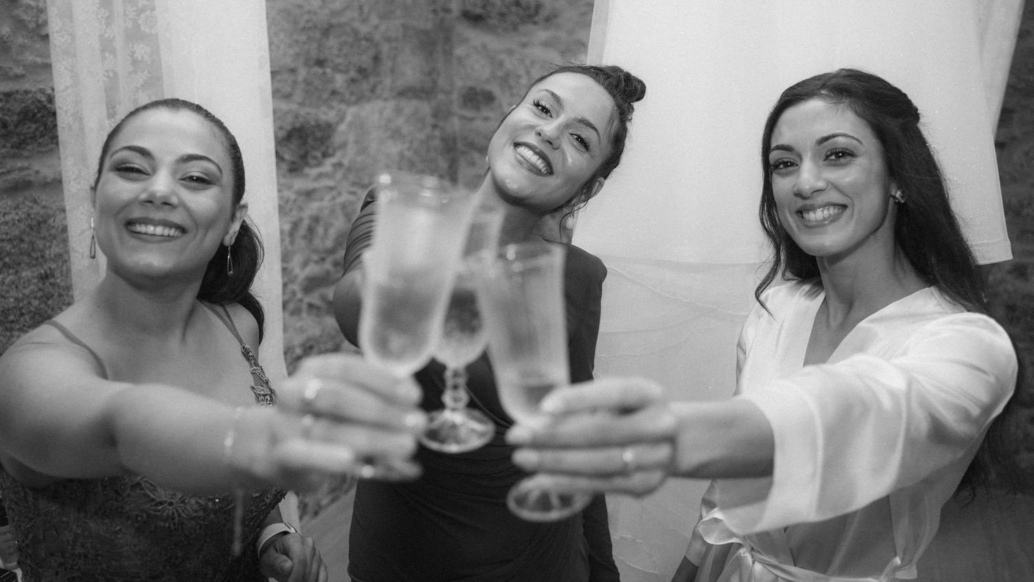 Black and white candid shots of people celebrating and laughing together.