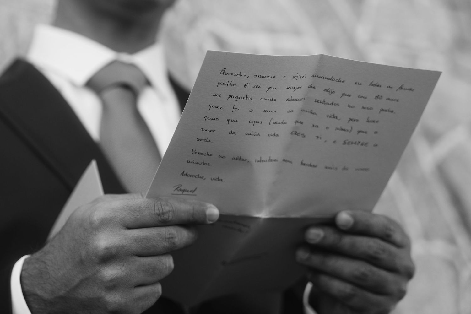 Black and white image of hands holding handwritten letters and notes spread across multiple photos.
