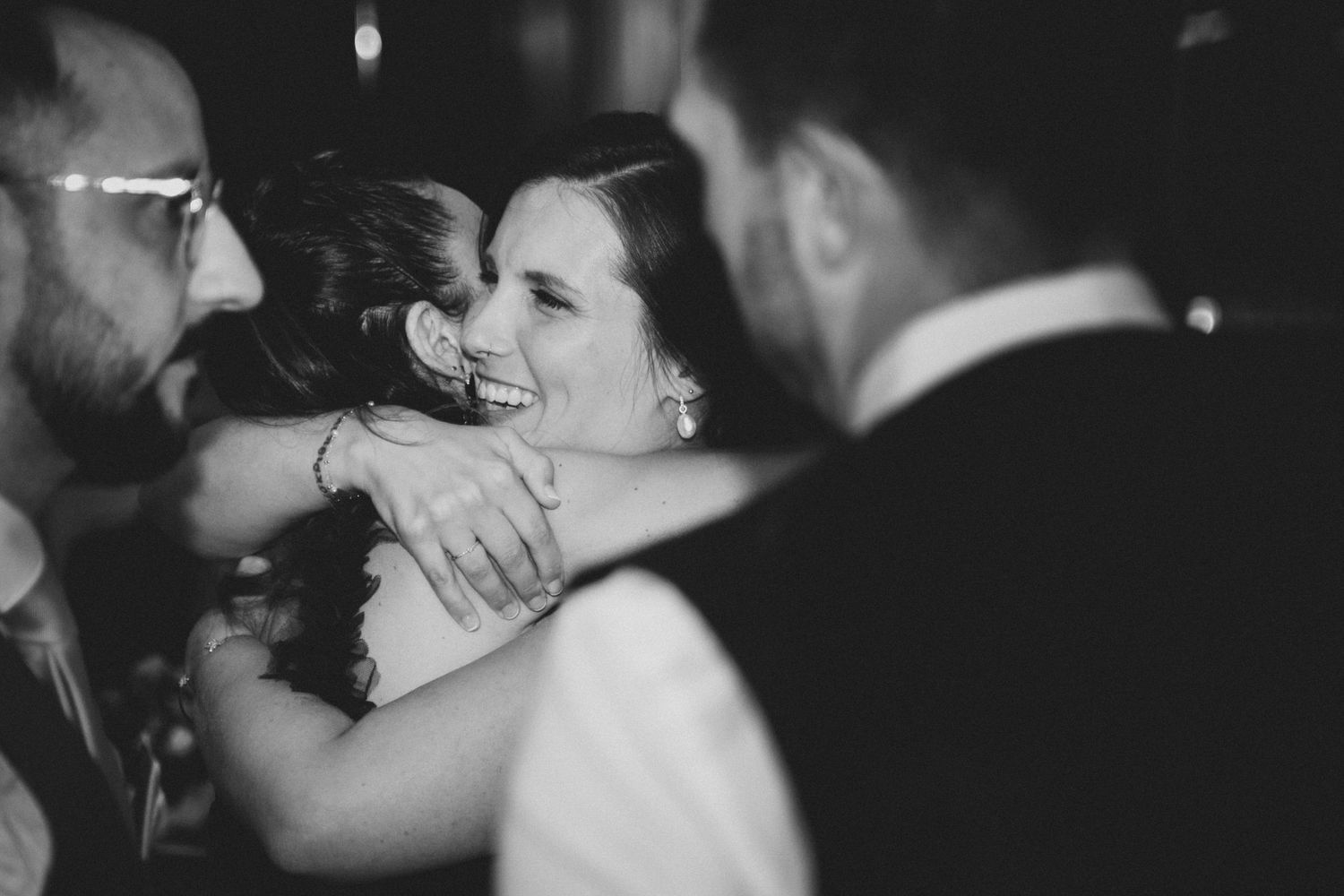 A series of black and white romantic wedding photos showing intimate dance and embrace moments at a reception.