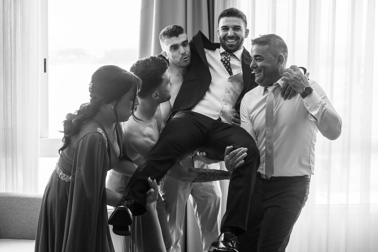 A series of black and white photos showing couples dancing together in an intimate setting.