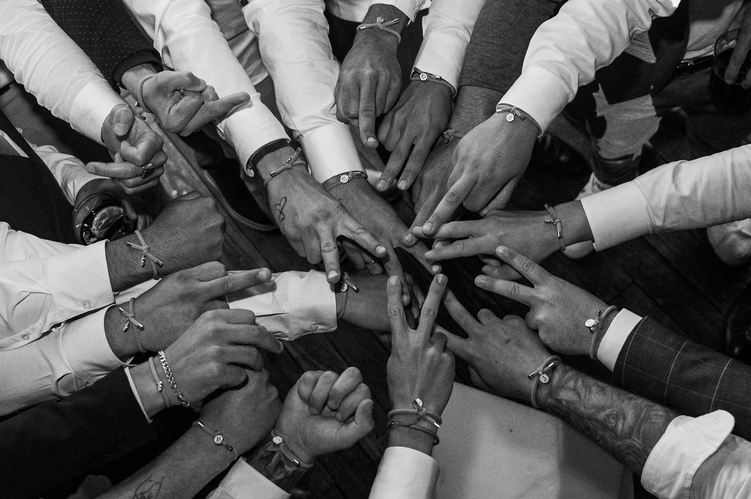 Hands holding smartphones in a circle formation showing social media and digital connectivity.