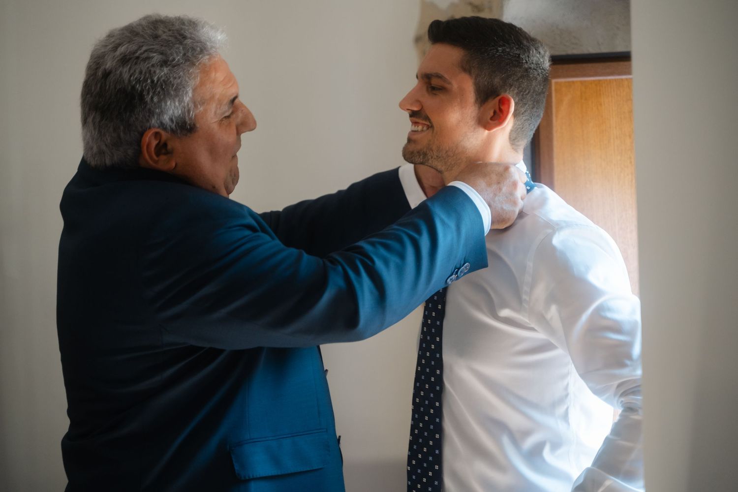 A sequence of photos shows a physical altercation between two people wearing business attire in an office setting.