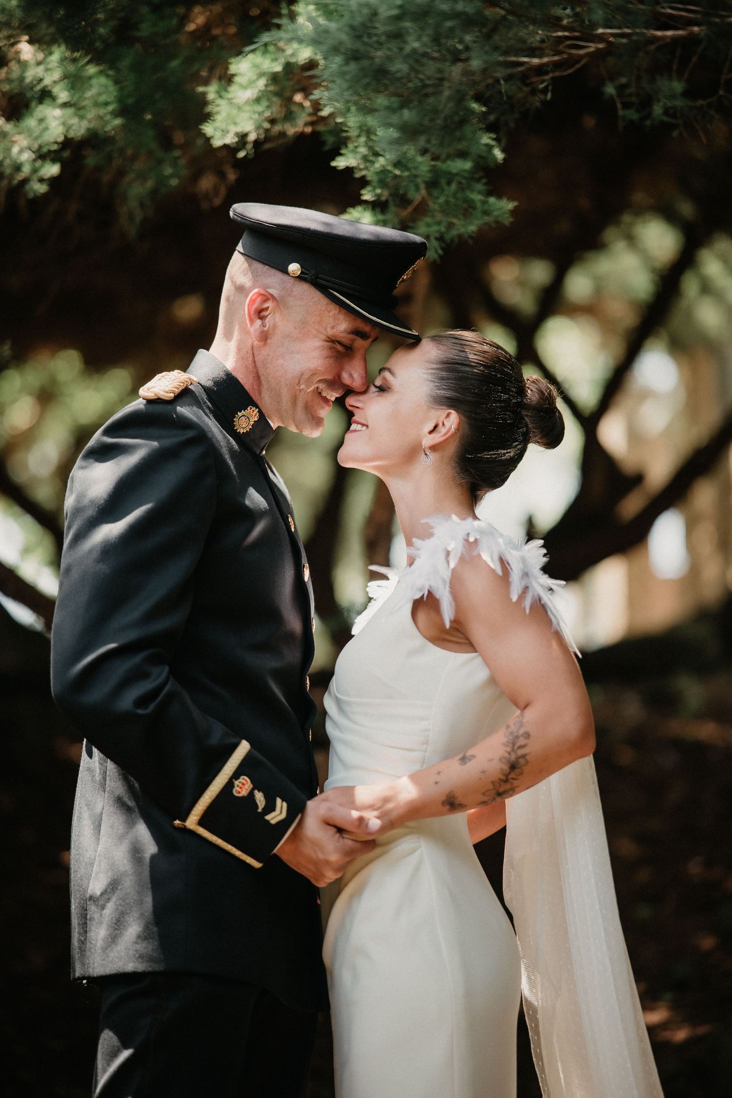 A romantic wedding couple shares intimate moments in a series of outdoor portrait photographs.
