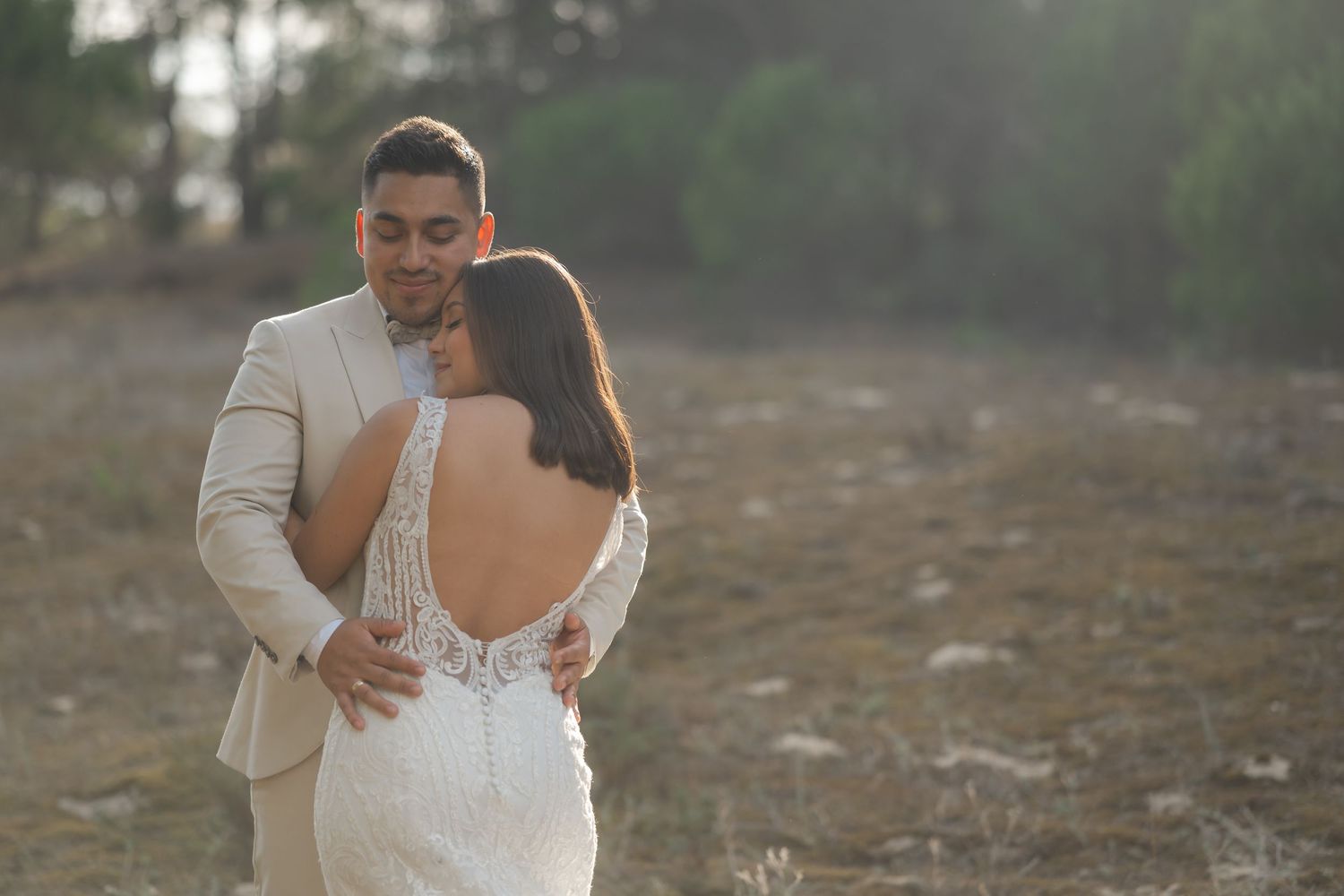 Romantic wedding photos captured in soft sunlight showing intimate moments between newlyweds.