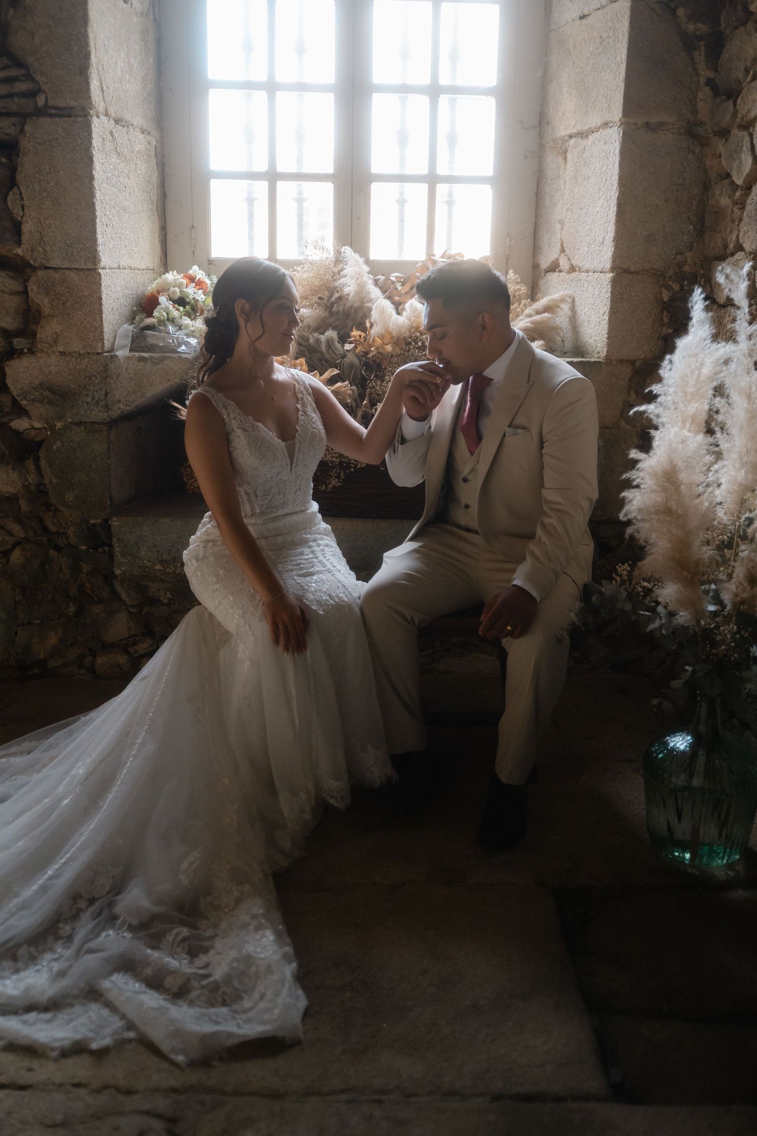 A series of romantic wedding dress photos showing flowing white gowns in an elegant rustic indoor setting with natural light.