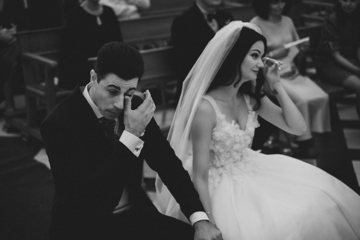 Black and white wedding ceremony photos showing elegant formal attire and romantic moments.