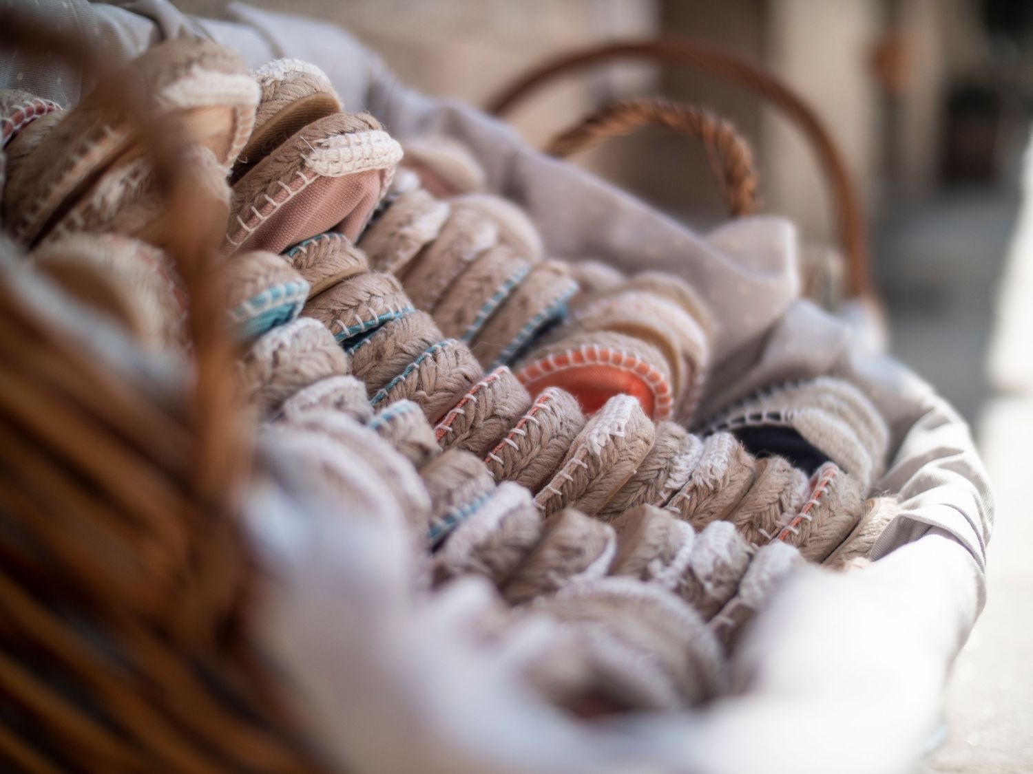 Close-up view of vintage baseball gloves stacked together showing weathered leather and worn textures.