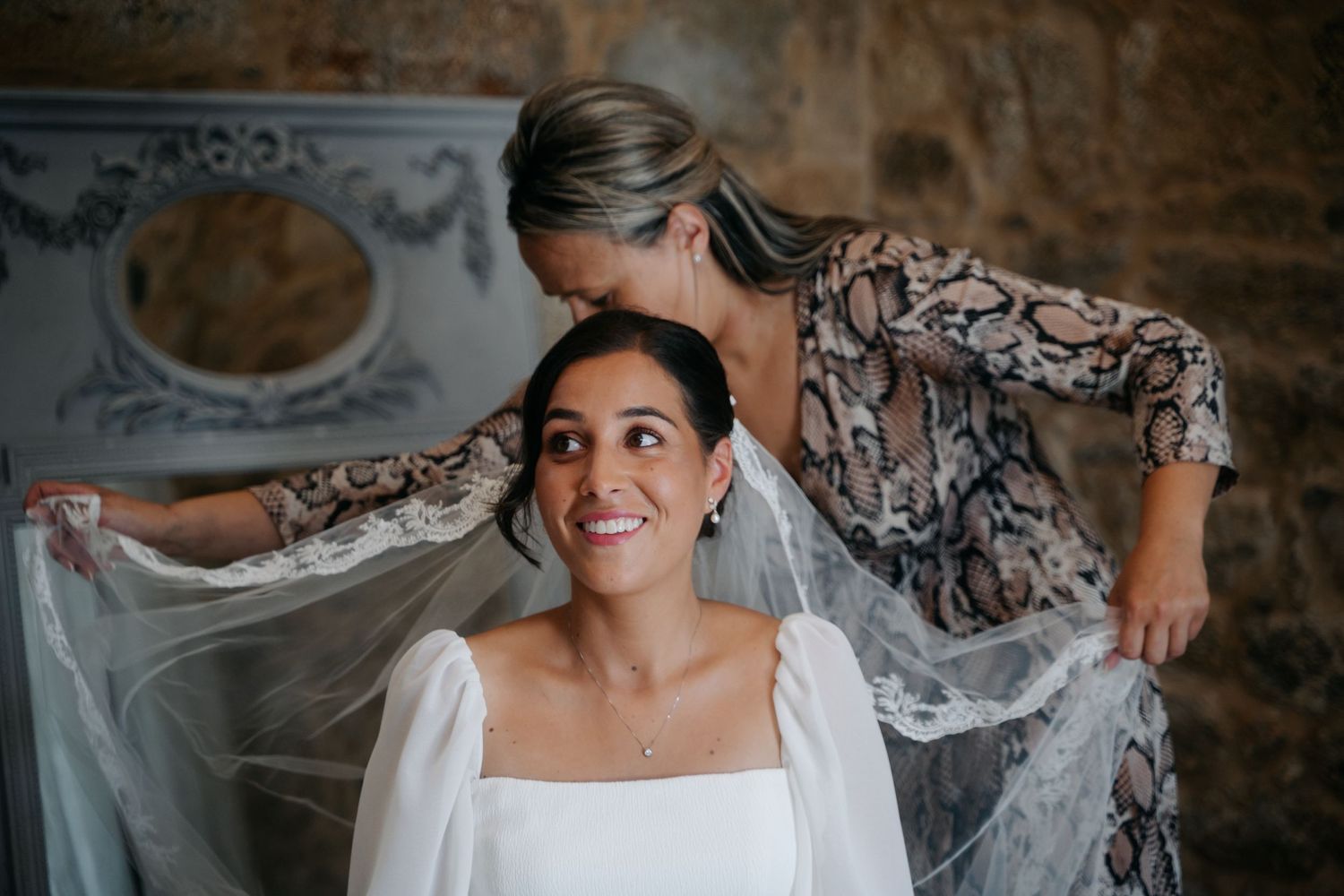 A series of wedding preparation photos showing details of a white dress, veil, and bridal styling moments.
