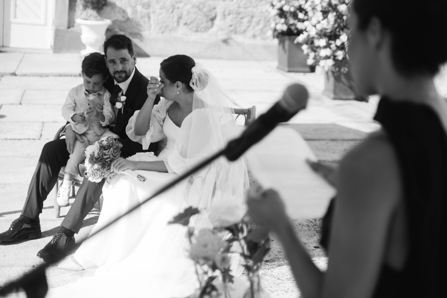 Black and white candid shots of wedding guests during reception celebrations.