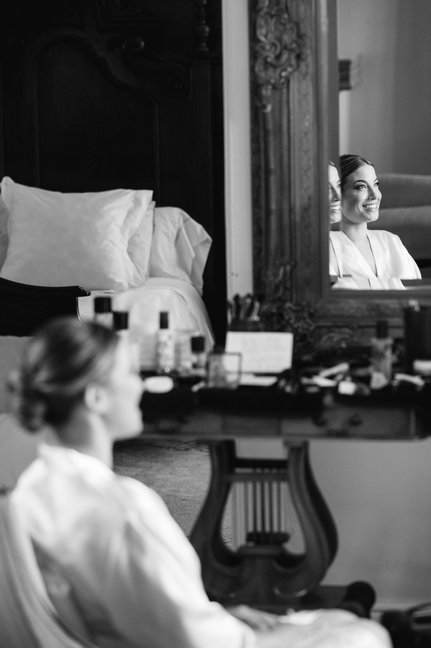 Black and white image showing a series of frames capturing a person in a white outfit in an indoor setting.