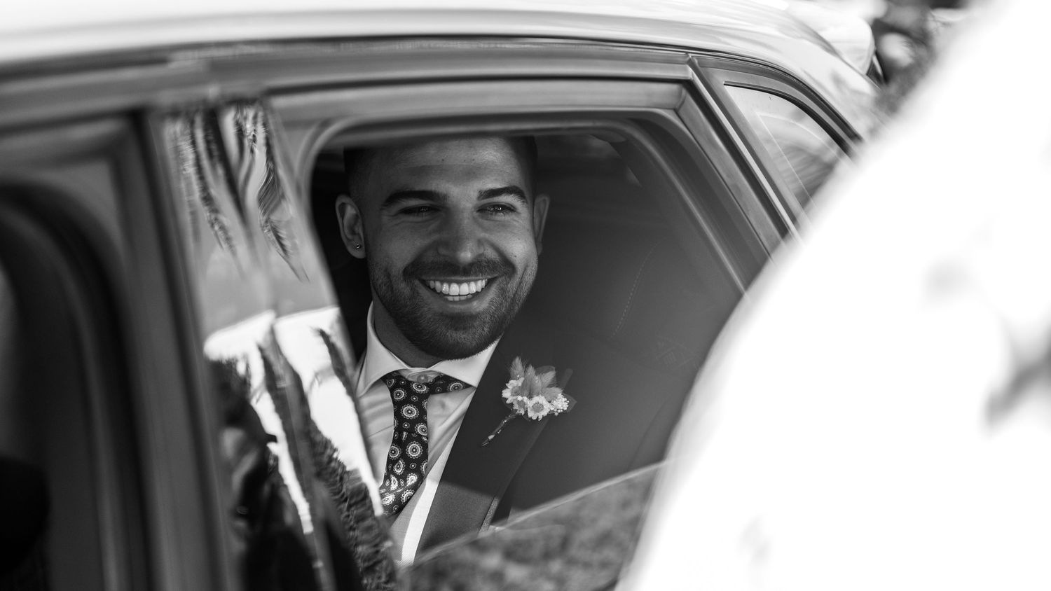 Candid moments captured through a car window showing joyful expressions and laughter.