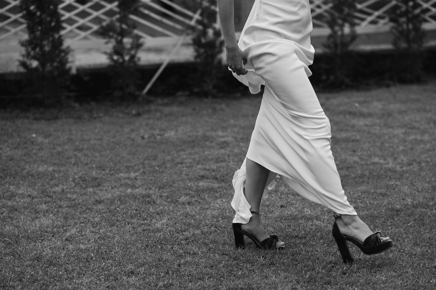 A series of black and white images showing legs and feet in motion on grass.Wedding photographer Spain. Galicia.