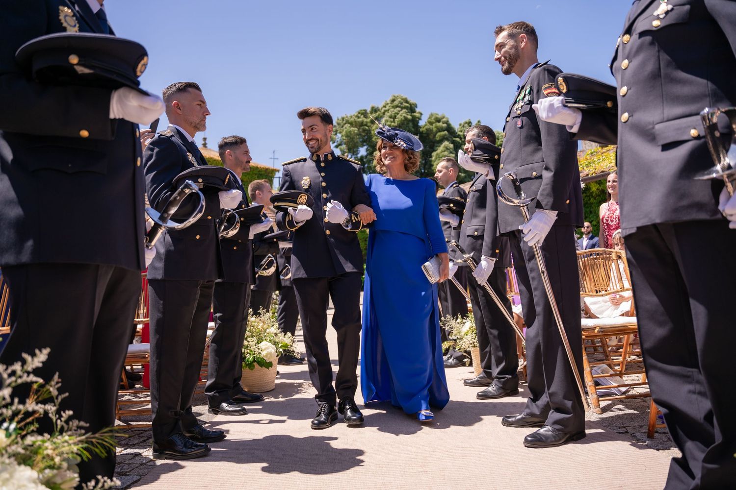A sequence of images showing guests at an outdoor wedding ceremony standing in line.
