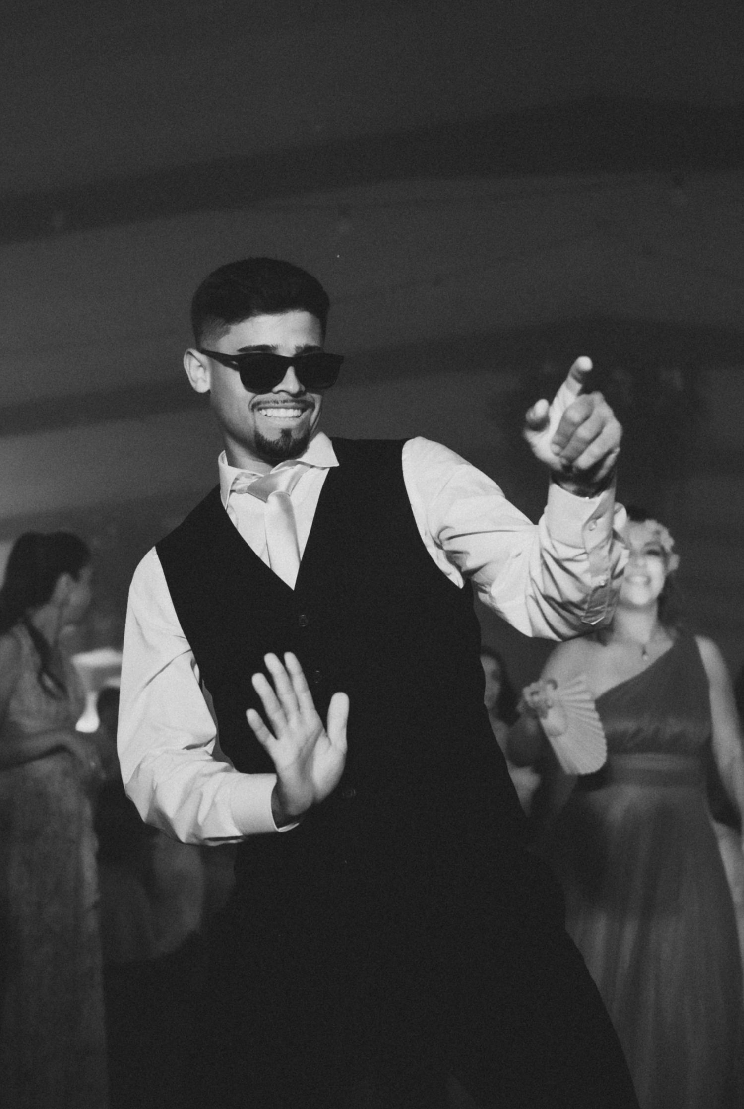 Black and white photo sequence showing two dancers in formal attire performing elegant dance moves together.