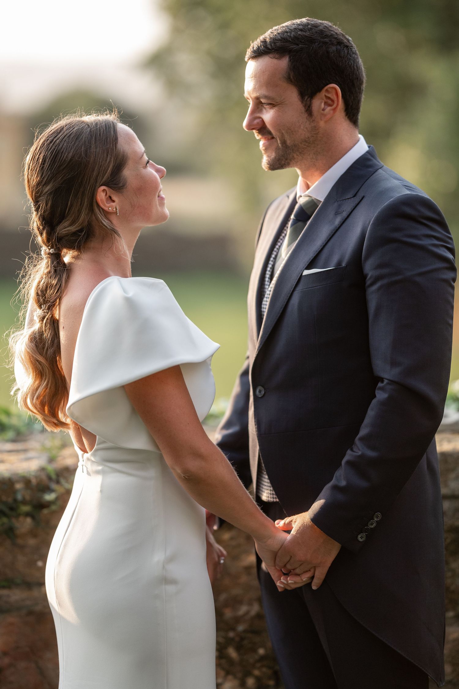 A romantic wedding photo sequence showing tender moments between a bride in white dress and groom in dark suit outdoors.